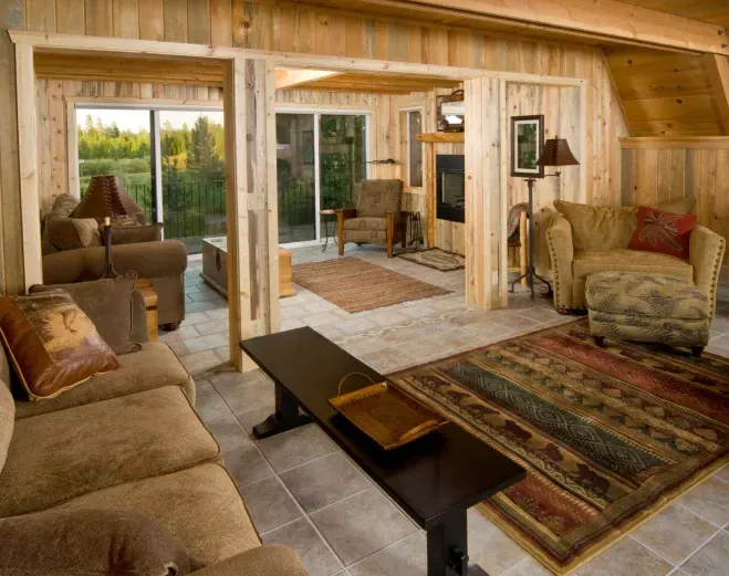 A living room filled with furniture and a rug