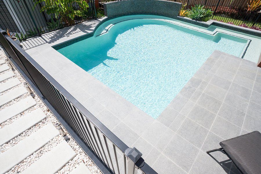 Aluminum railing surrounding a pool for safety