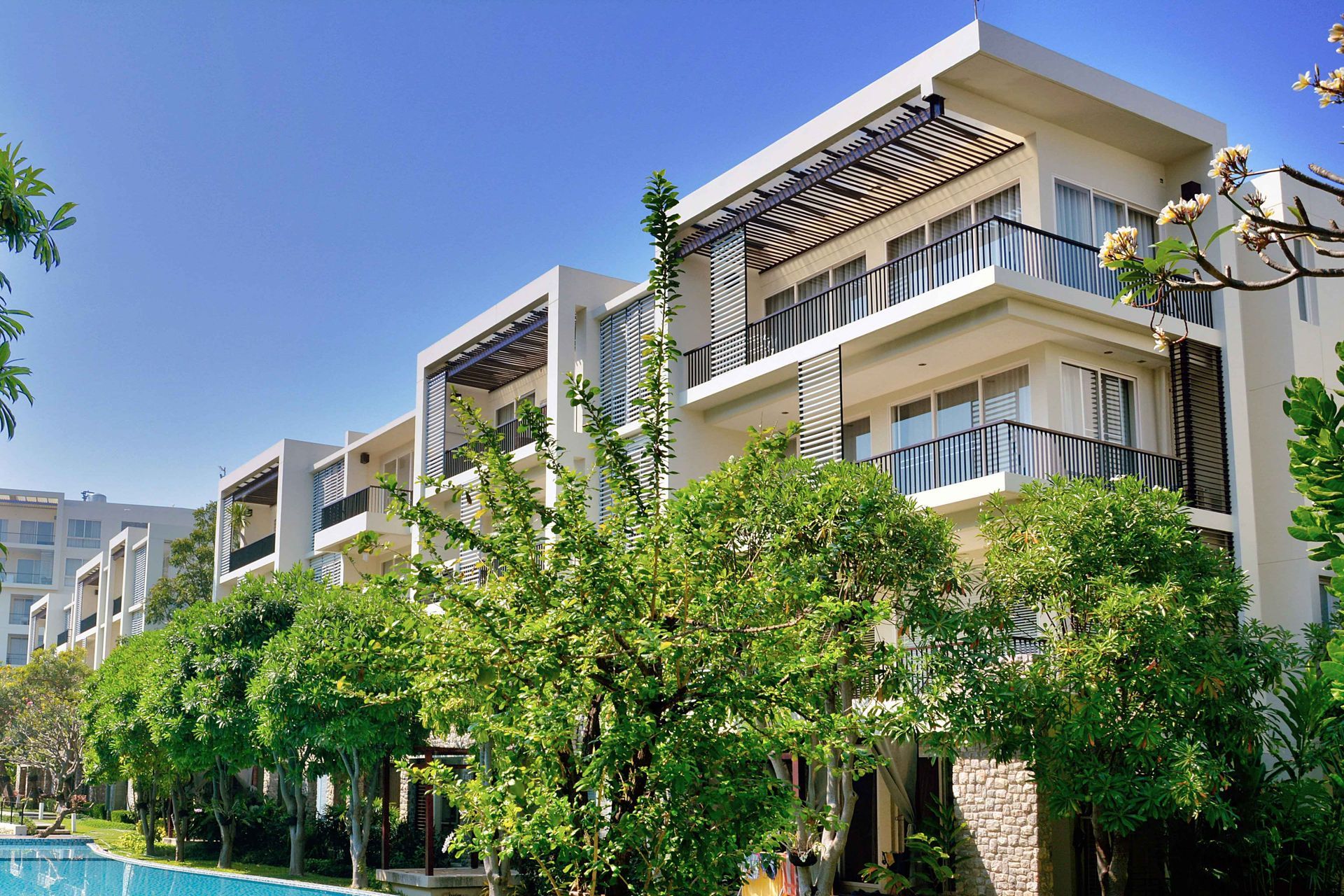 Modern apartments with wrap around balconies and clean handrail design