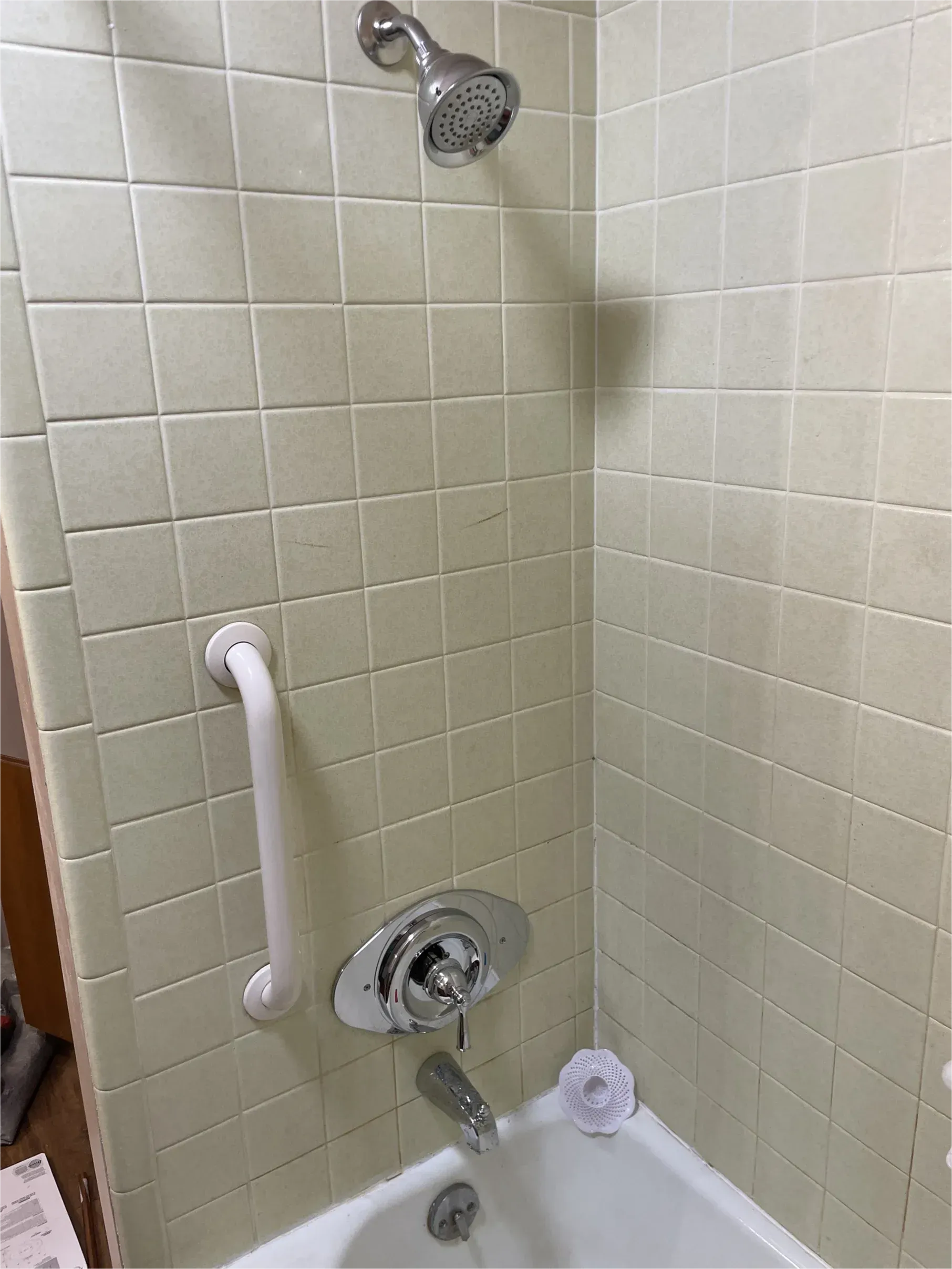 A bathroom with a bathtub and a shower.