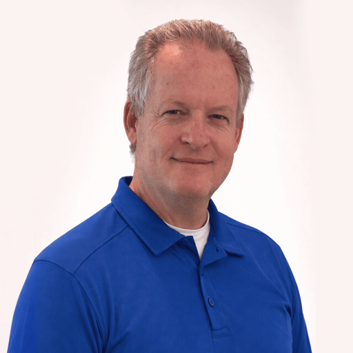 Portrait of a man in a blue polo shirt against a plain white background