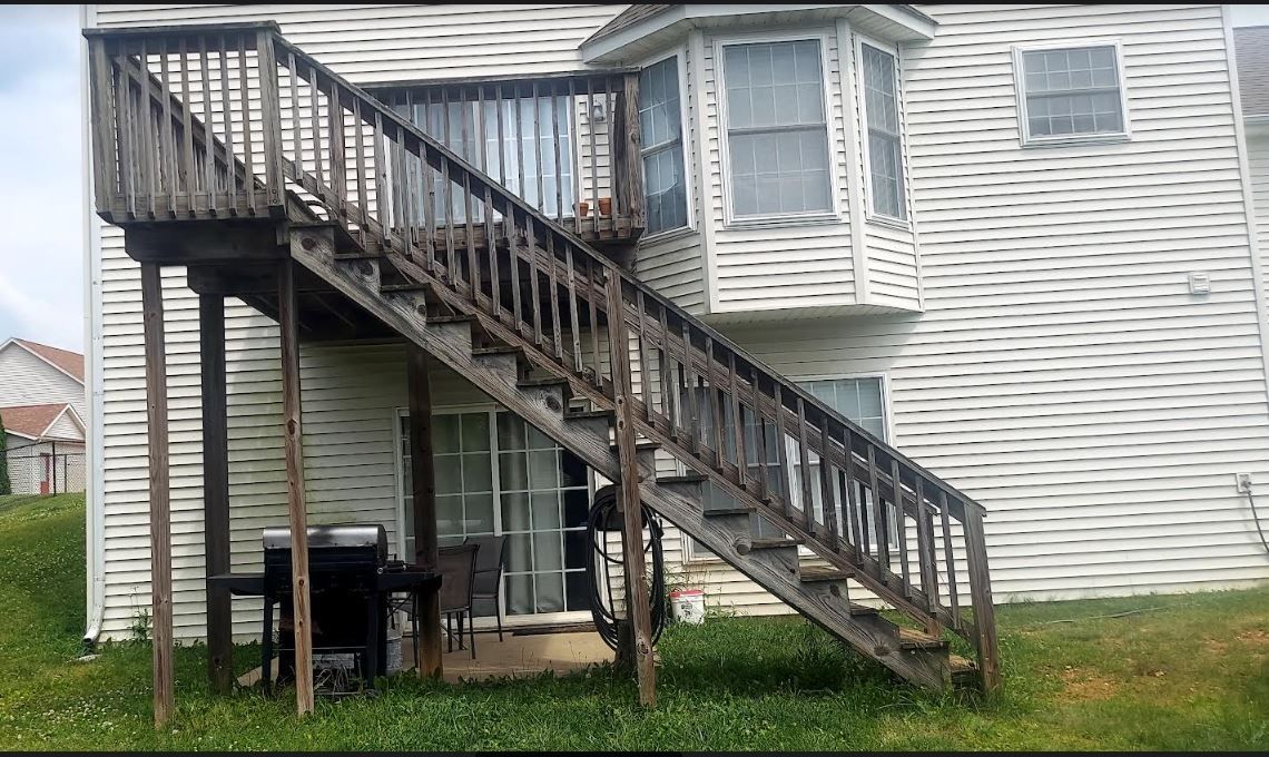 A wooden deck with a staircase