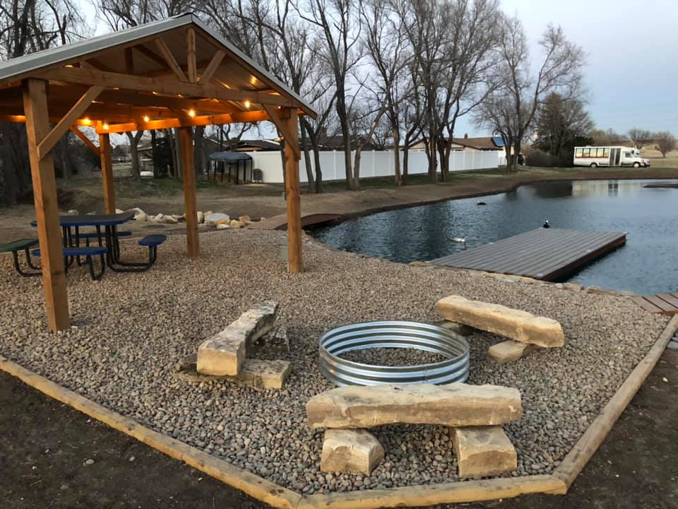 Creek Side Resort Fishing Pond and campfire in Hays, KS