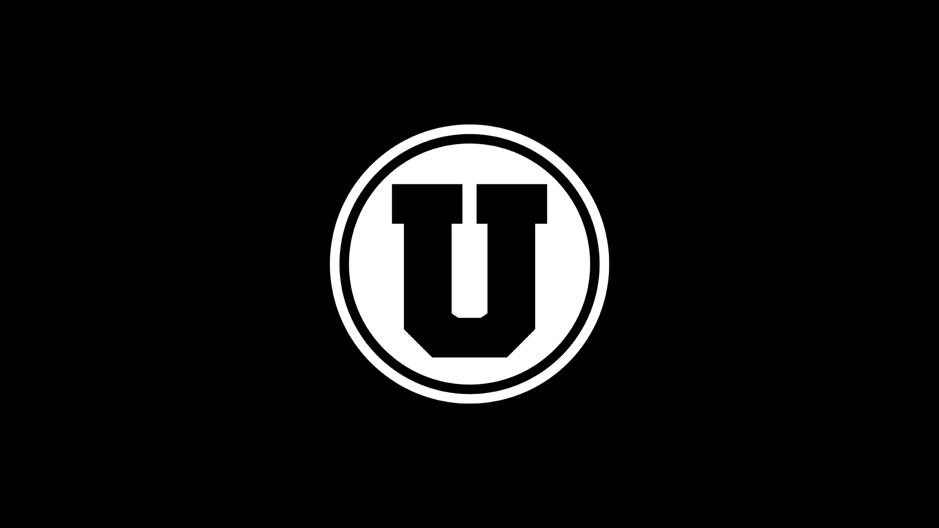 Black rectangle with a white circle containing a white, uppercase