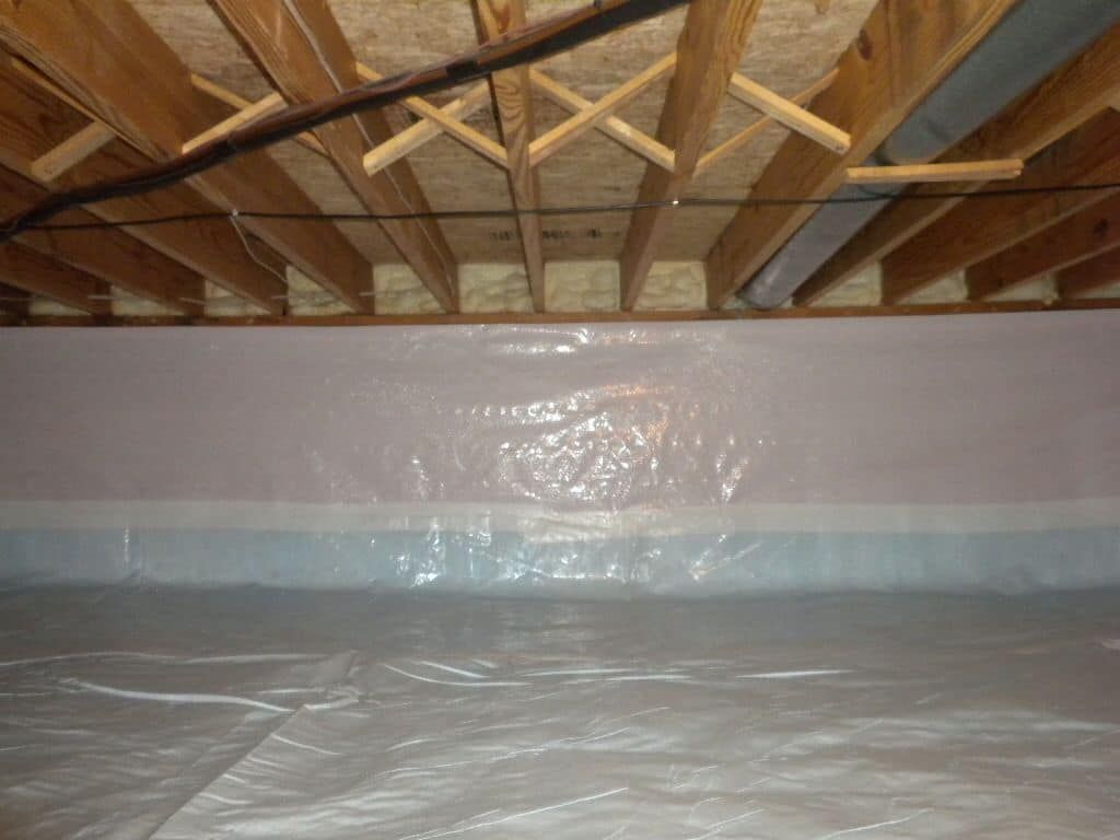 A basement filled with plastic and wooden beams.