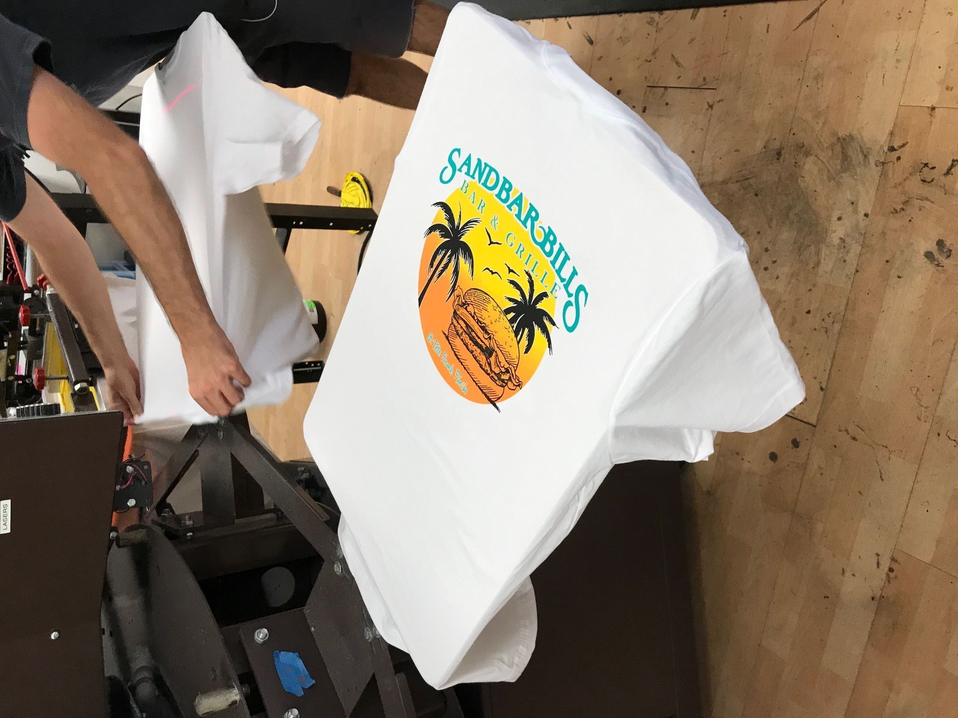 A white t-shirt with the words sandbar bills on it