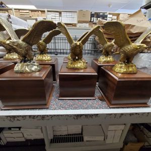 A bunch of statues of eagles are sitting on a table