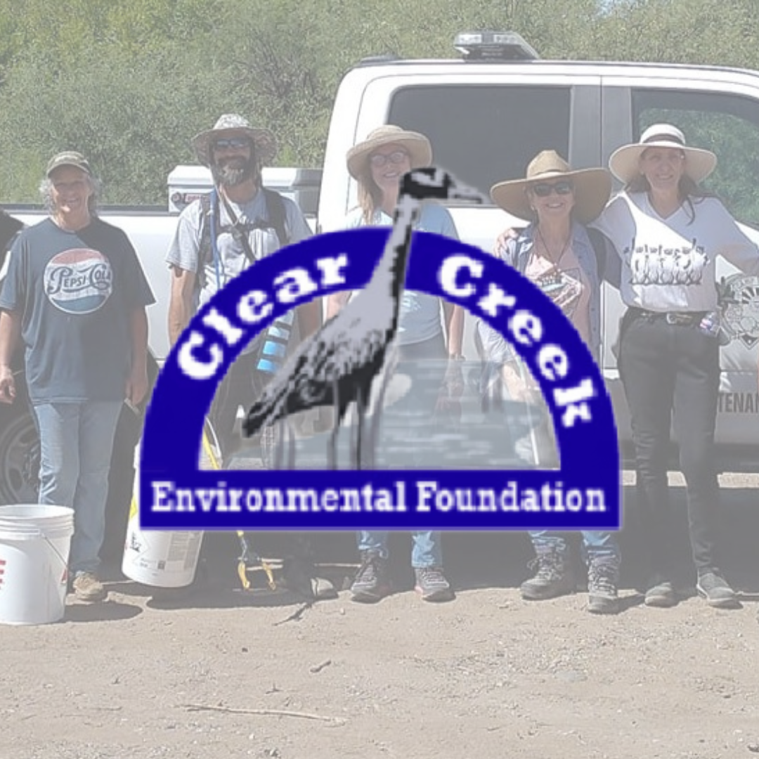 A group of people standing in front of a truck that says clear creek environmental foundation