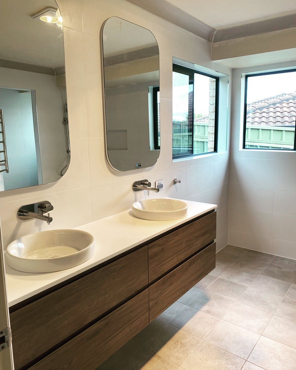 A Bathroom With Two Sinks And Two Mirrors โ Custom Design Bathroom Renovations in Port Macquarie, NSW