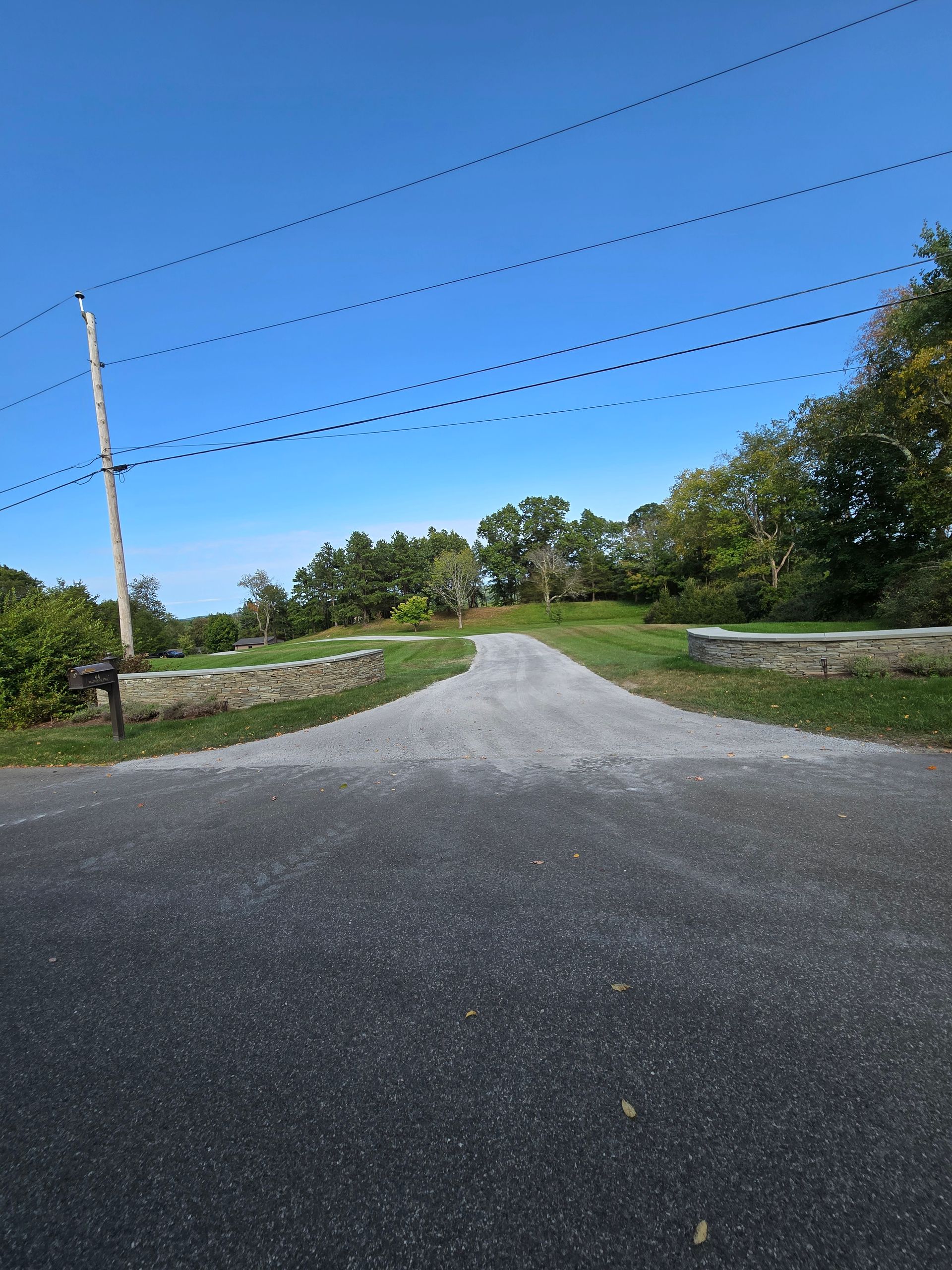 A road with a lot of power lines on it