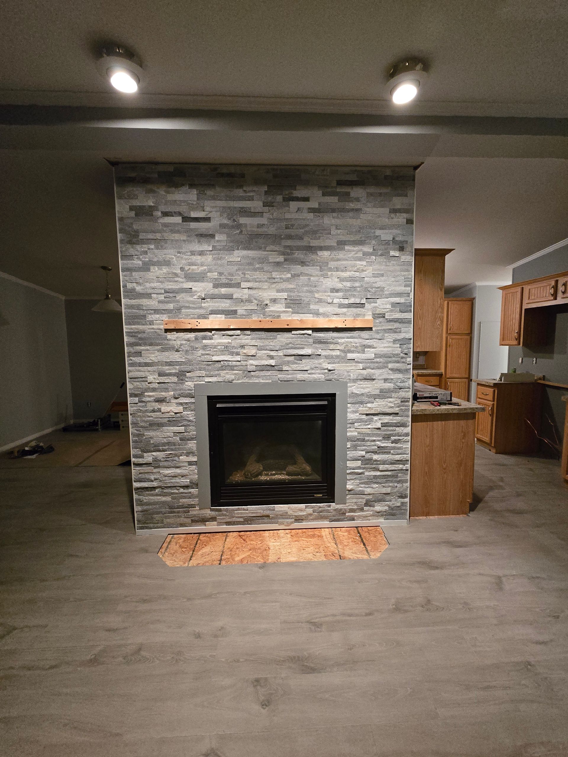 There is a fireplace in the middle of the room.