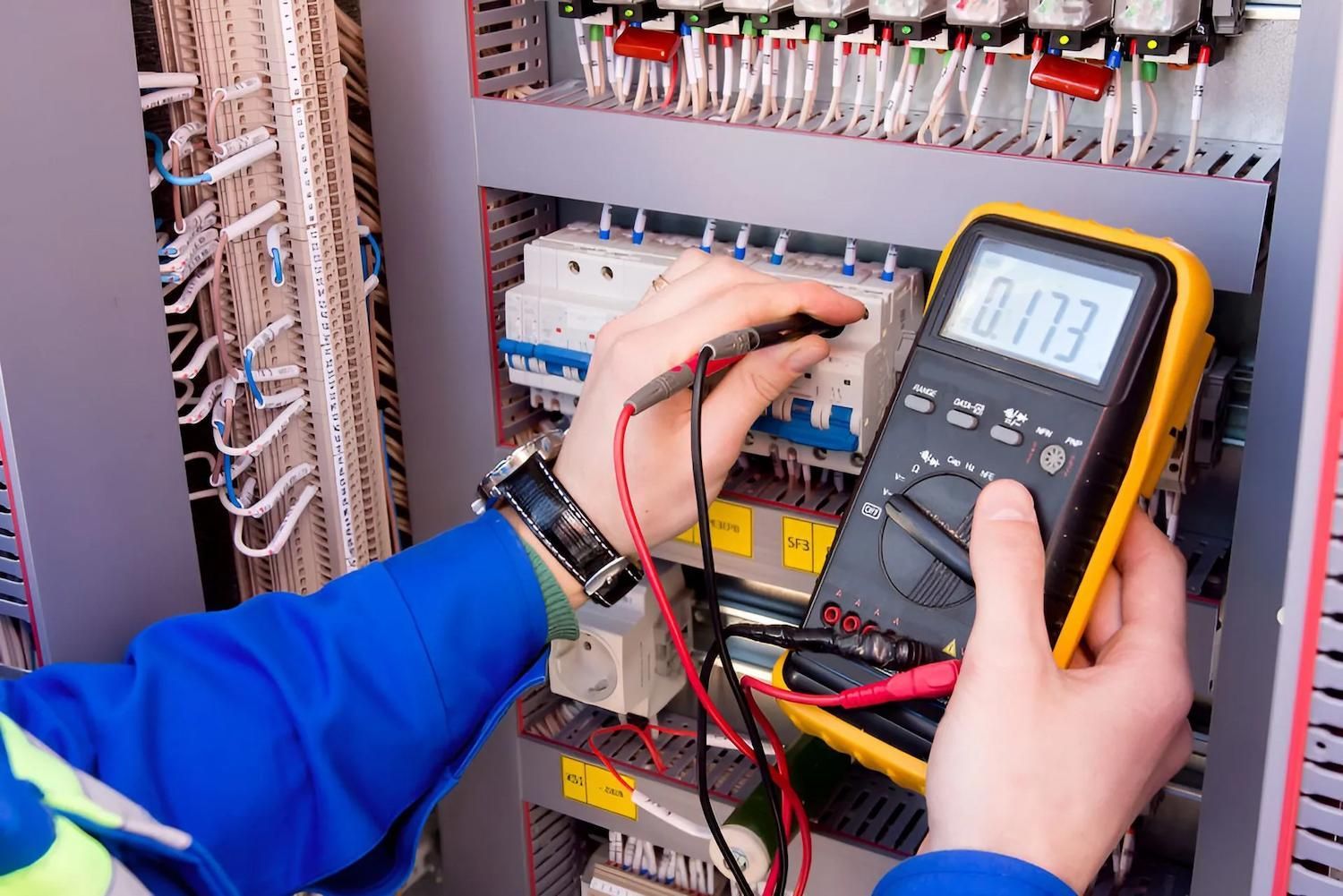 Electricians In Cairns Working On Switchboard