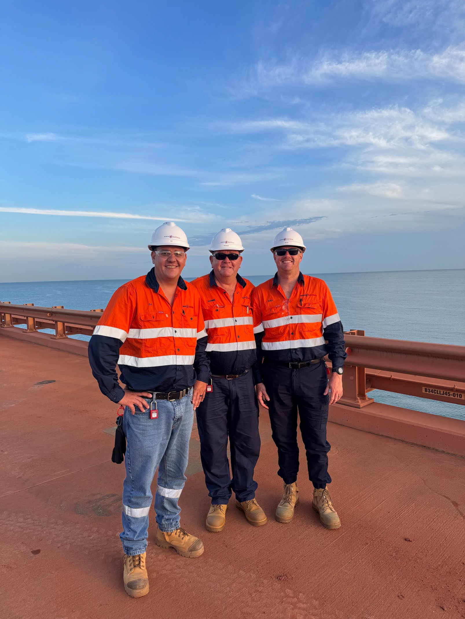 Electricians at Work on Dirt Road — Robon Electrical In Weipa, QLD