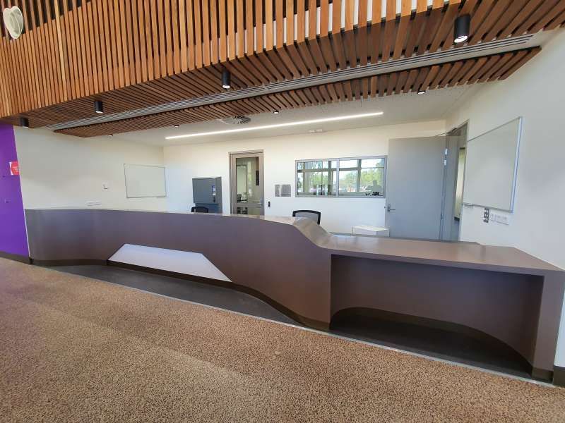 There is a long counter in the middle of the room.