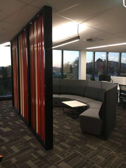A room with a couch and a table in it
