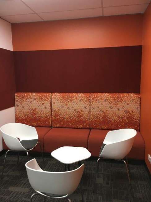 A living room with a couch and chairs and a table