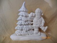 Santa leaning on tree