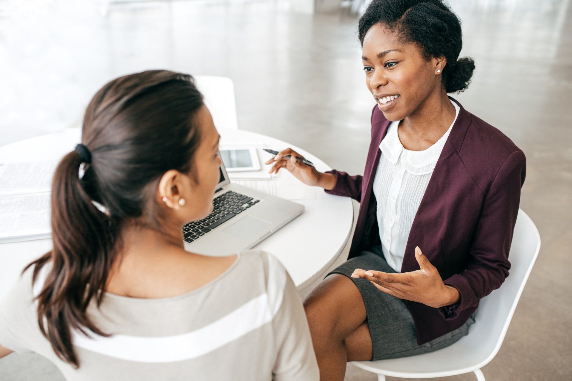 Woman talking to her client — Charlotte, NC  — All Points Insurance
