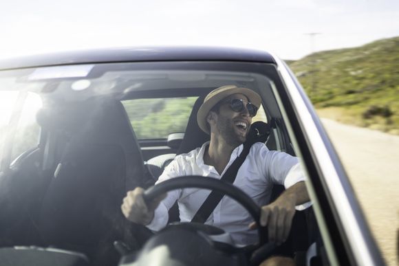 Happy man inside the car — Charlotte, NC  — All Points Insurance