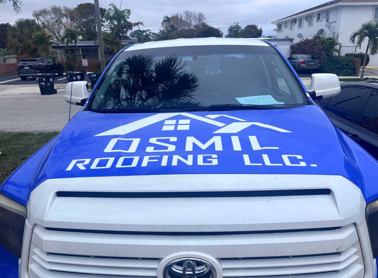 A blue and white Toyota truck with the 