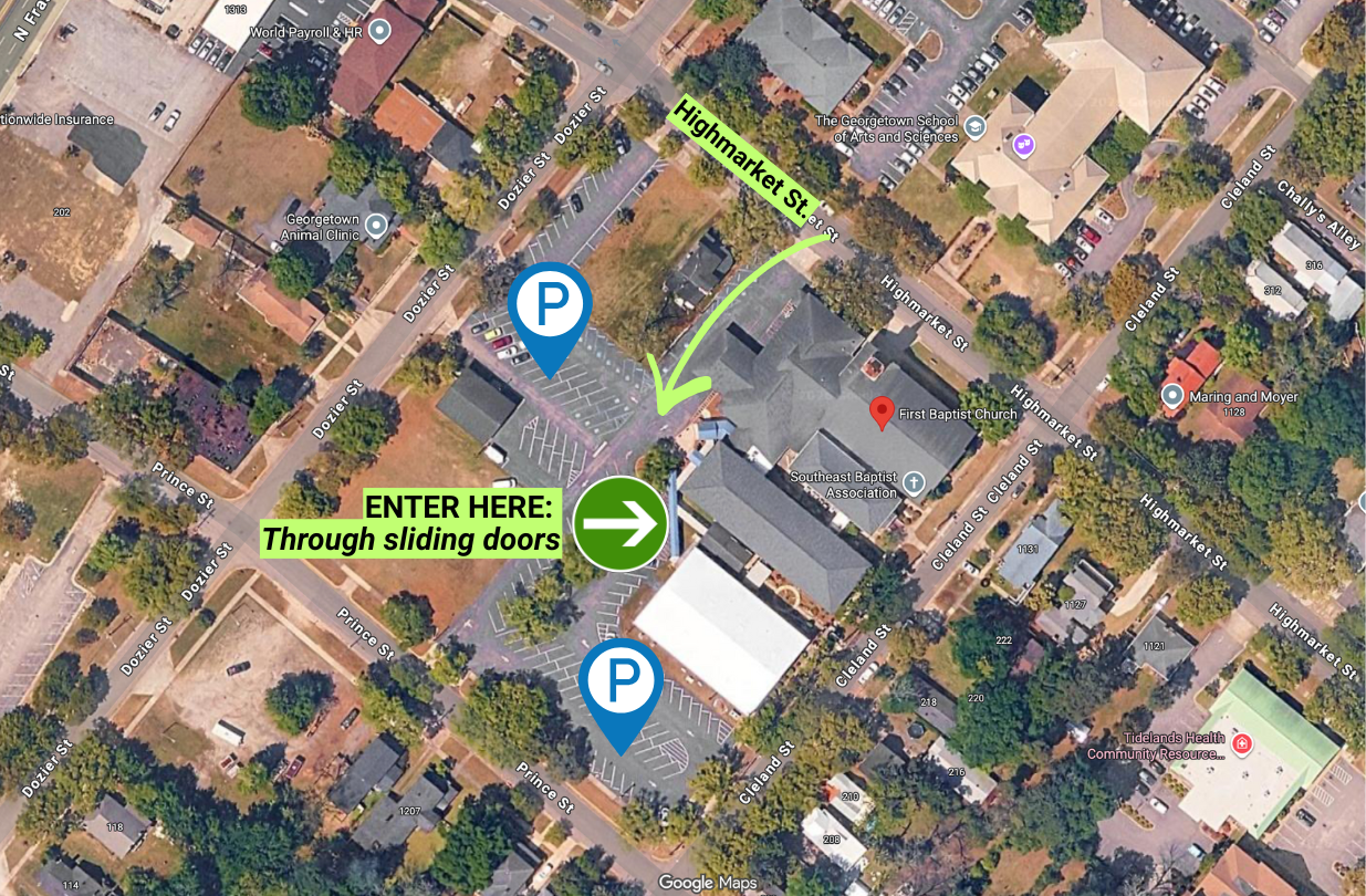 Aerial map with green arrows and “ENTER HERE” sign directing traffic near parking spots.