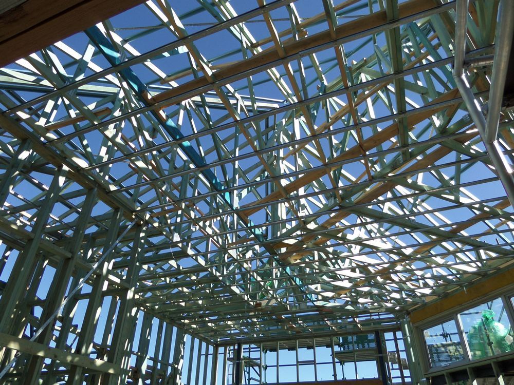 Looking Up at the Ceiling of a Building Under Construction — Hume, ACT — Universal Trusses