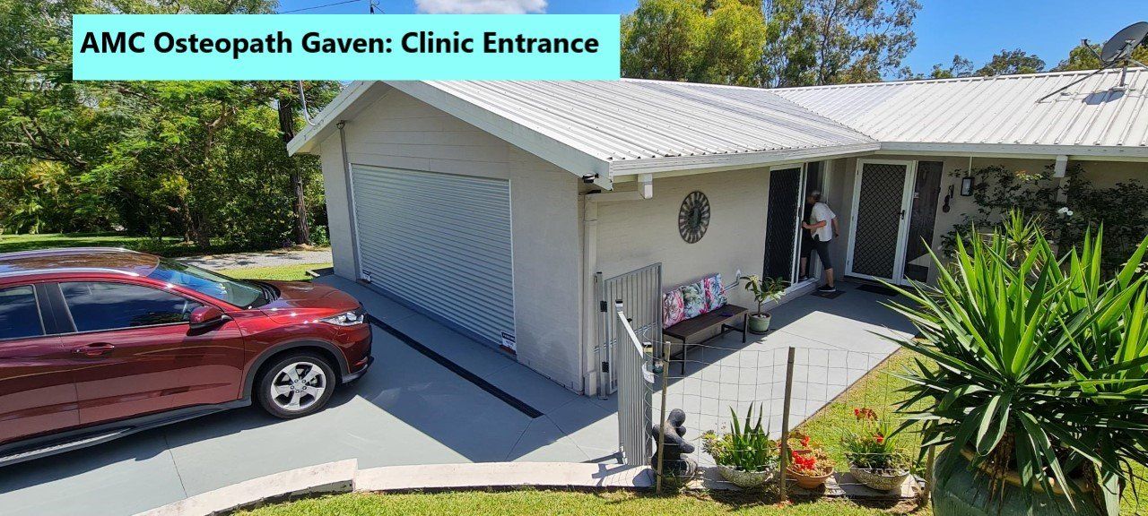 Easy parking right outside the clinic A person walking through the entrance doorway at osteopathy clinic at Gaven on the Gold Coast