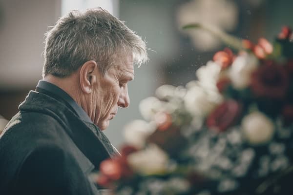 Man Mourning Indian Rocks Beach Funeral Service