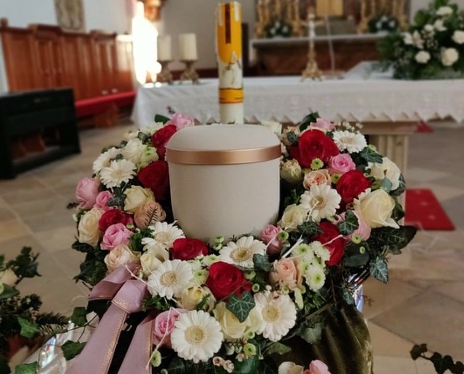 Cremation Urn Surrounded by Funeral Flowers in Indian Rocks Beach