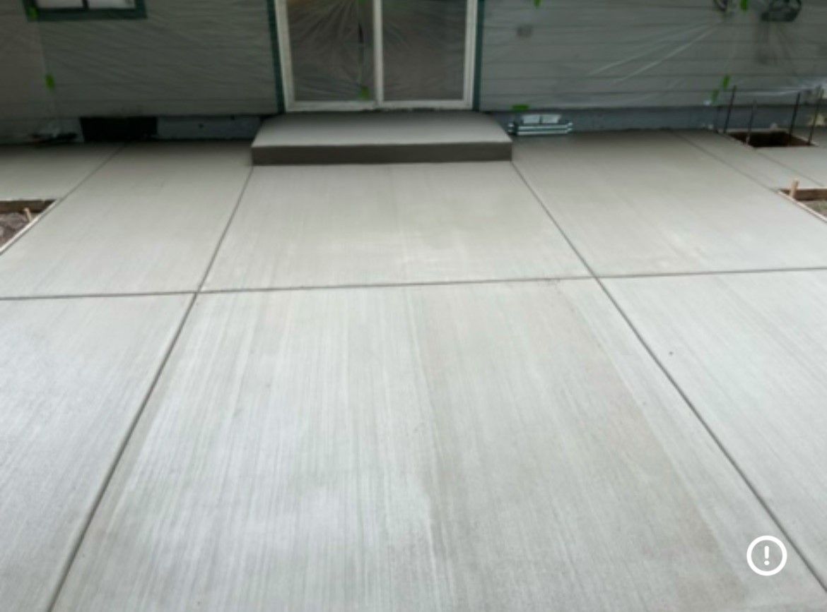White tiled floor leading to glass entrance doors in a modern indoor lobby