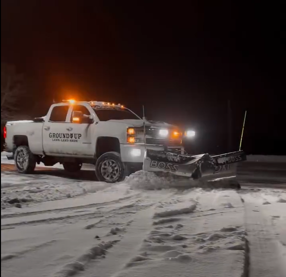 One of our trucks plowing a commercial property