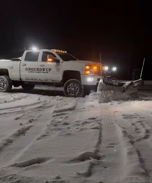 Plowing an office location in Hudson, Ohio at night
