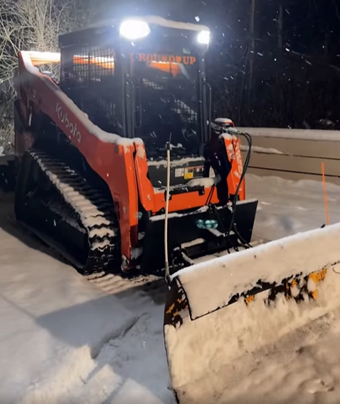Small Skid Steer for plowing sidewalks and walkways