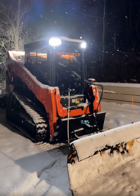 One of our skid steers plowing a walkway in Streetsboro
