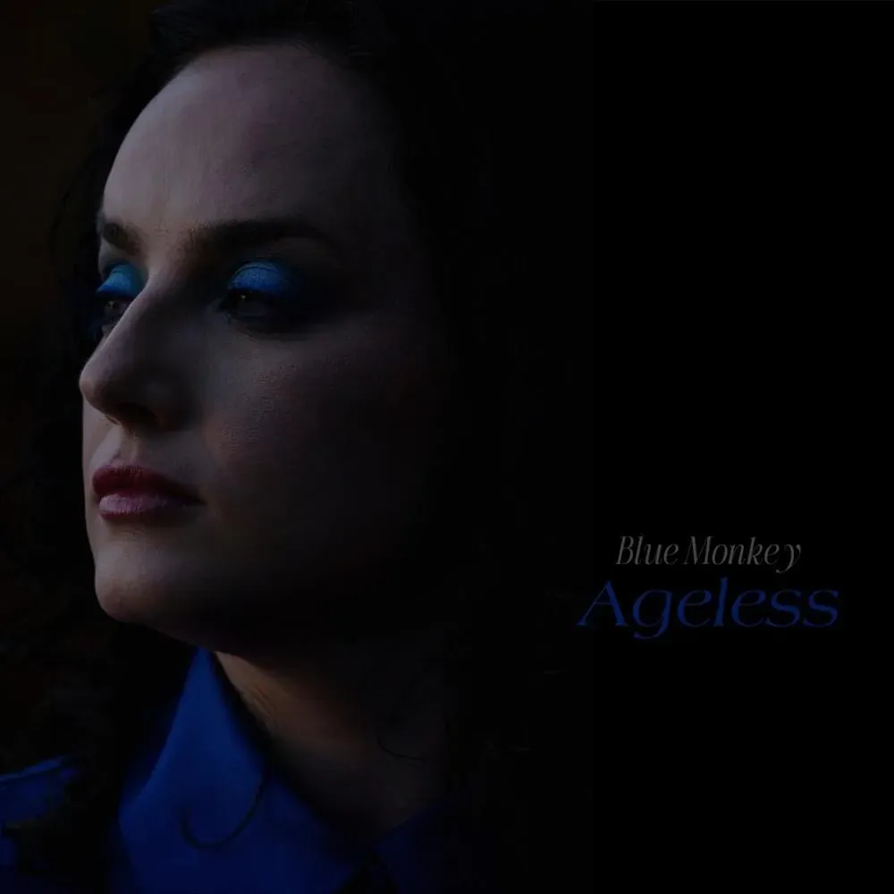 Woman with blue eyeshadow looks left, with “Blue Monkey Ageless” text on the right.
