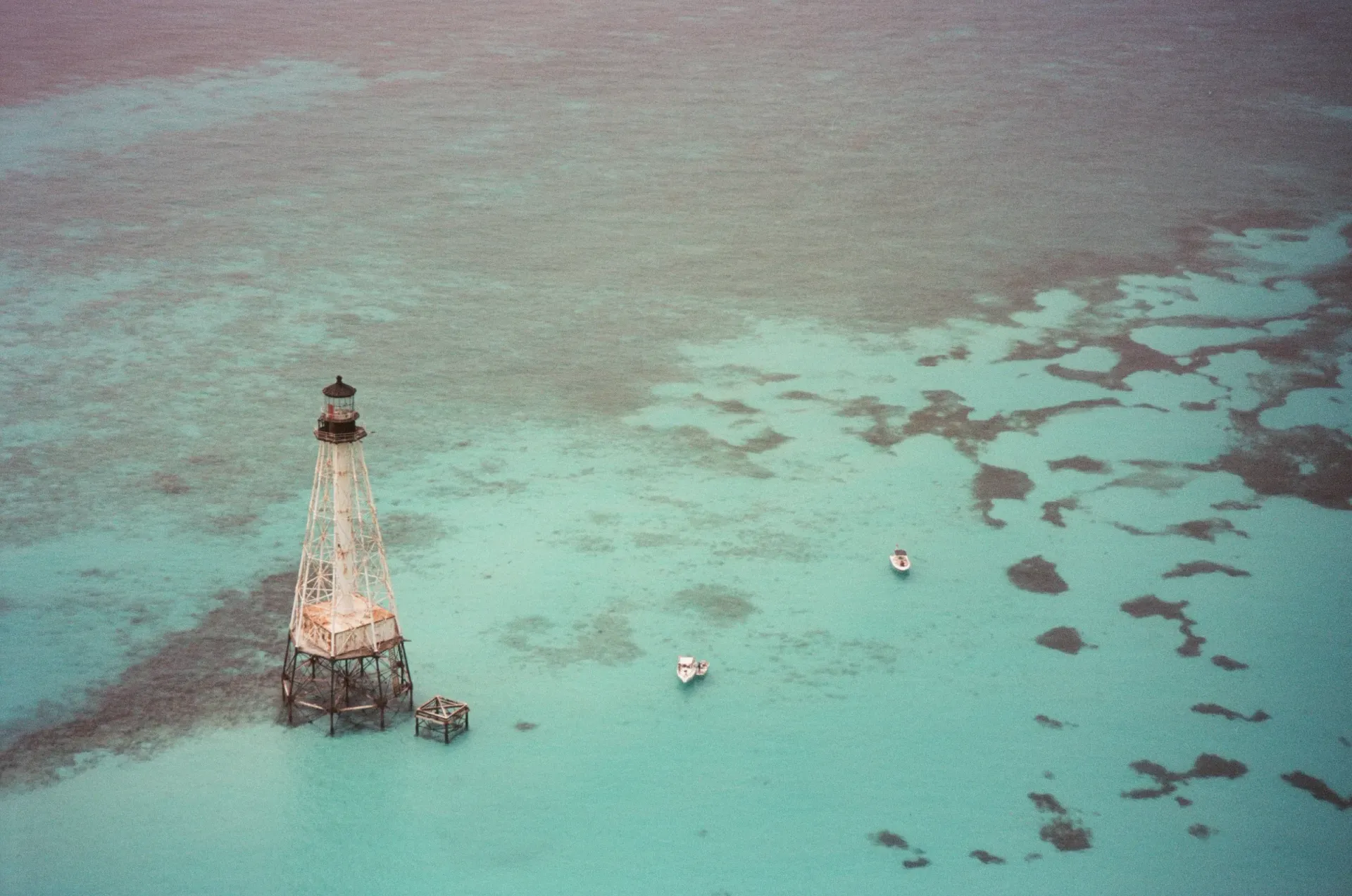 Aerial film photograph of Alligator Reef lighthouse off the Florida coast 