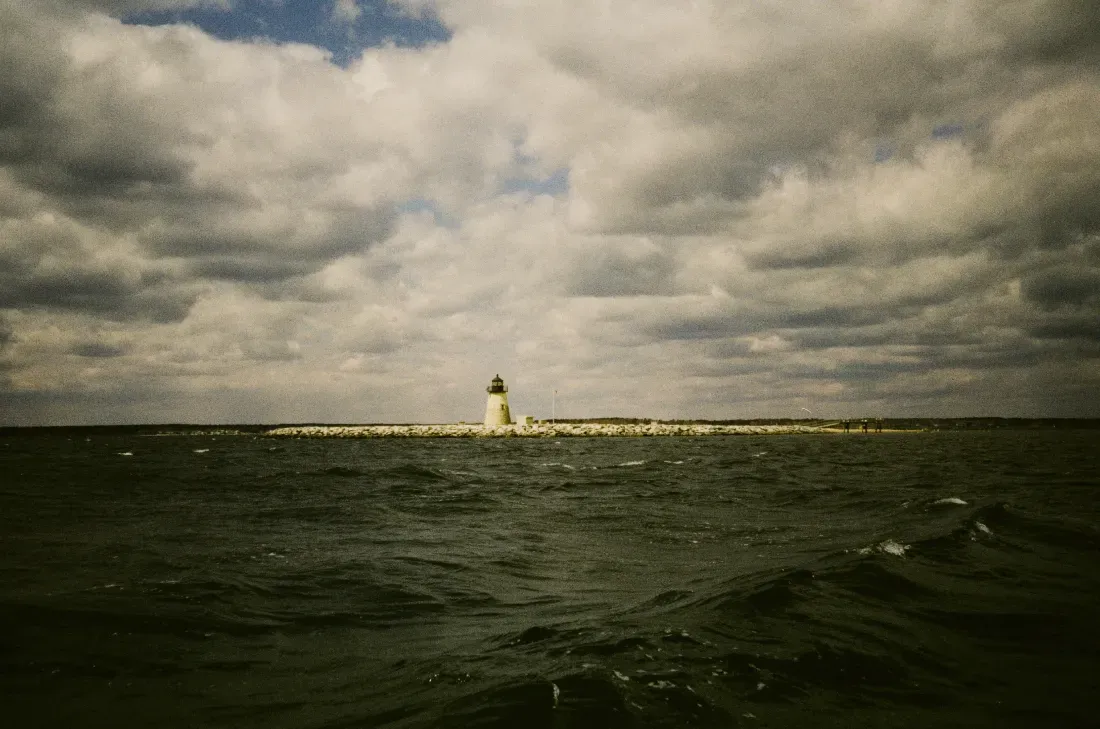A landscape film photograph of bird's island lighthouse on a rocky island