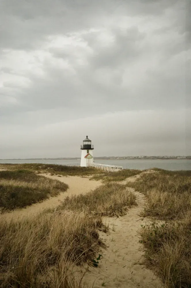 A film photograph of the Brant Point lighthouse in the distance