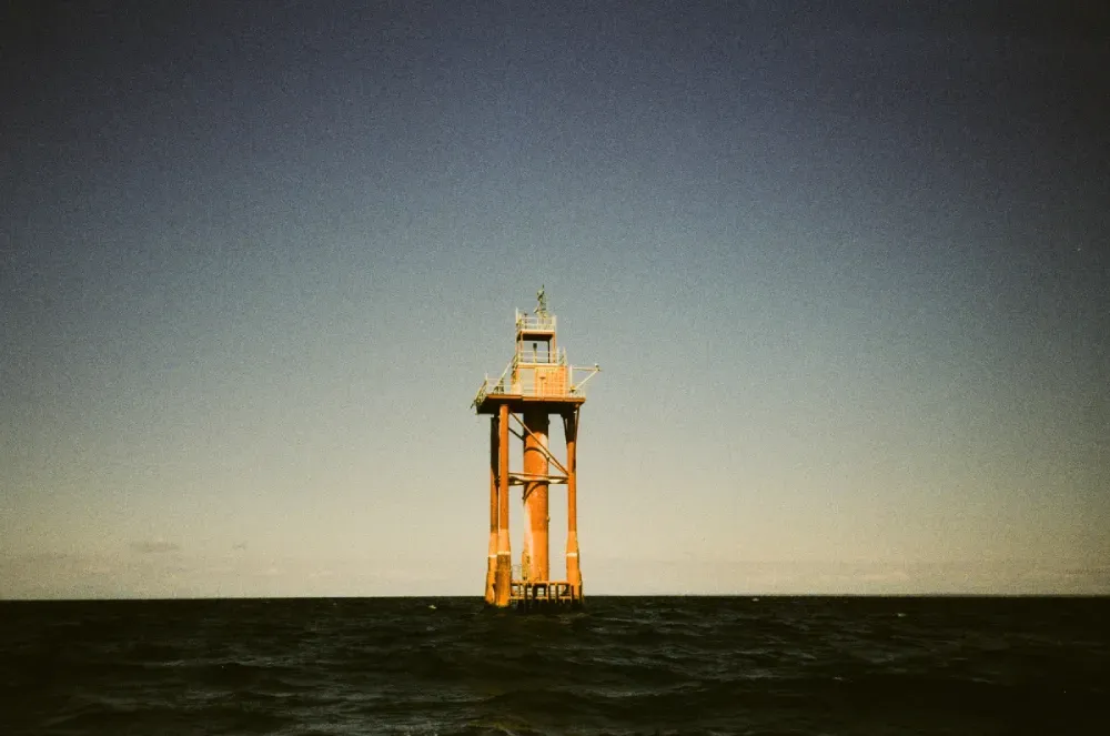A film photograph of the Buzzards Bay lighthouse in Massachusets