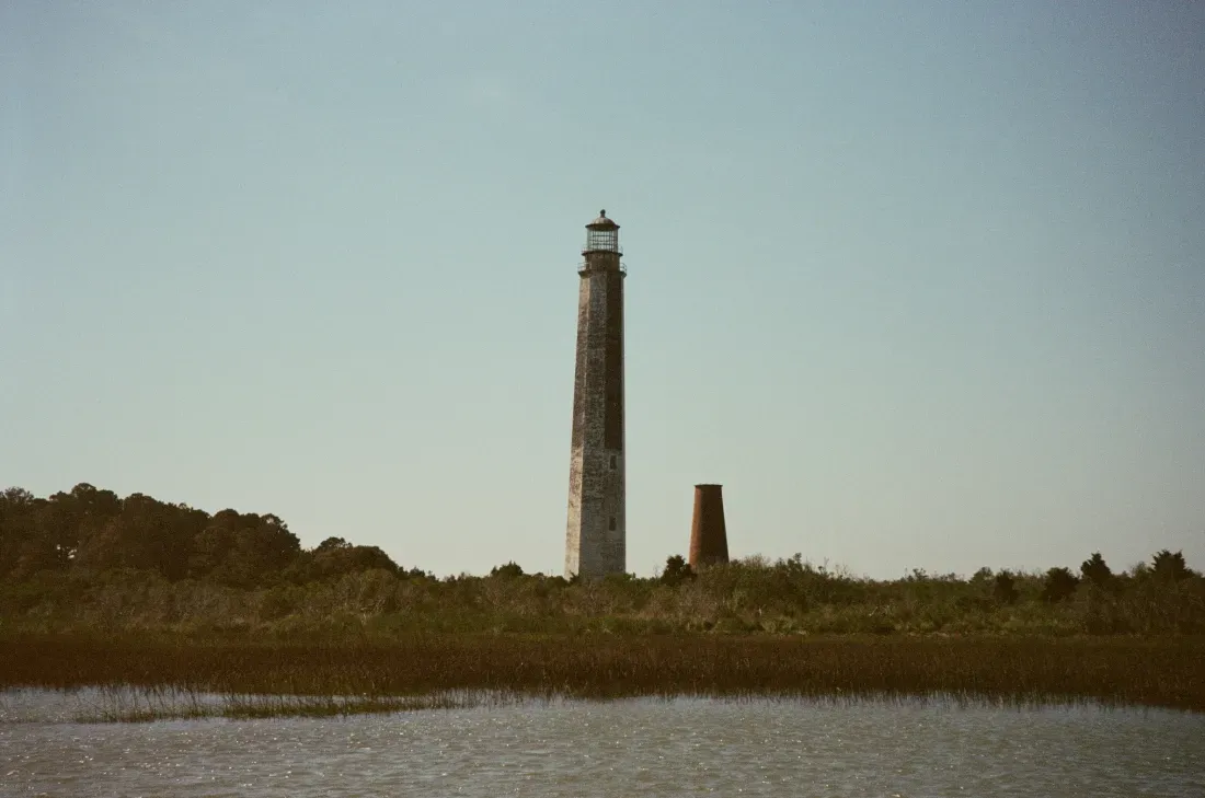 A landscape film photograph of Cape Romain lighthouse in South Carolina