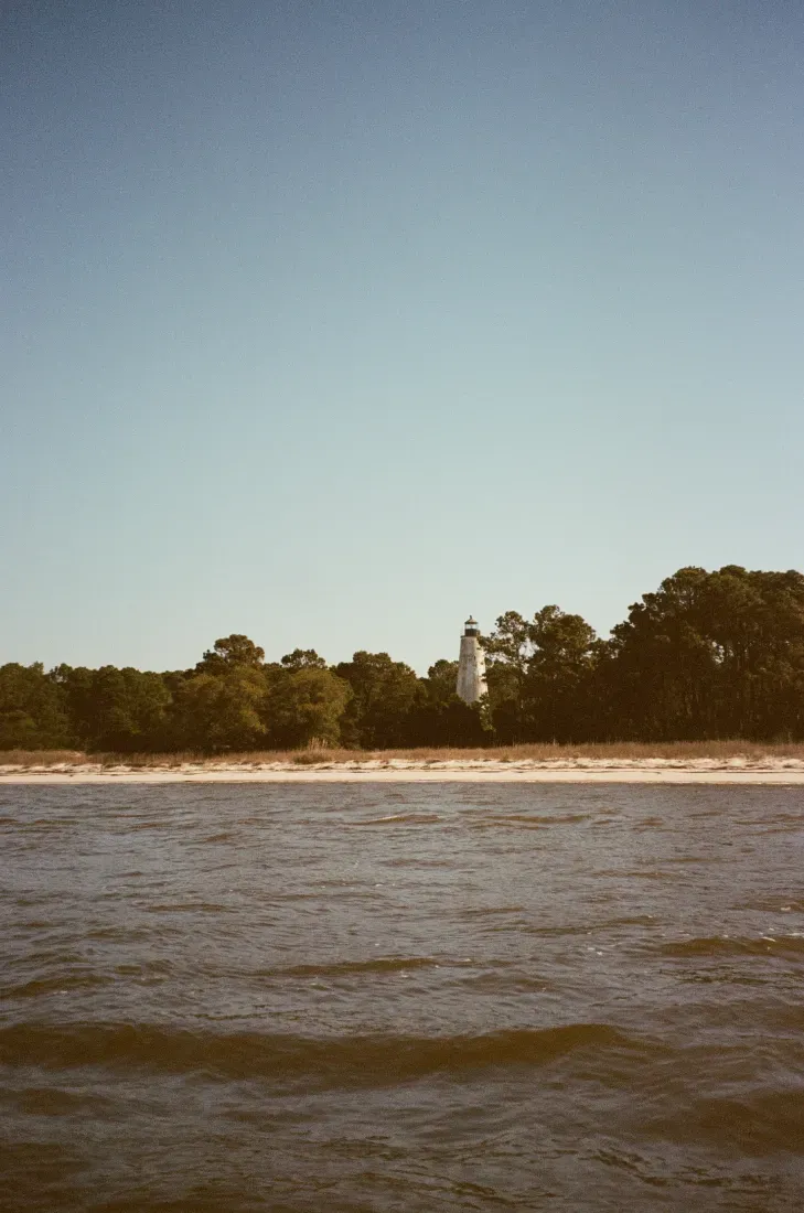 A film photograph of the Georgetown lighthouse in the distance