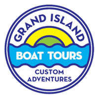Logo for Grand Island Boat Tours, featuring a yellow and green sunrise over blue waves with text on a circular blue frame.