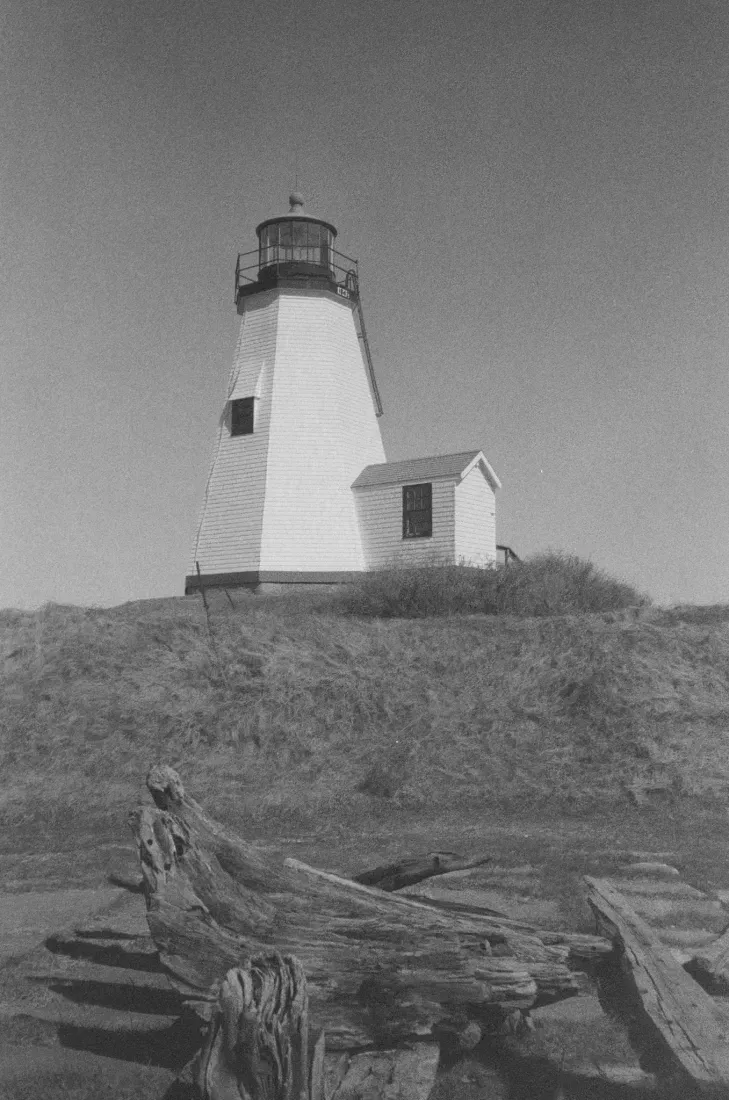 A black and white film photograph of Gurnet lighthouse in Massachusetts