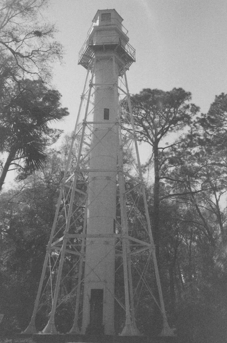 A black and white film photograph of Hilton Head lighthouse in South Carolina