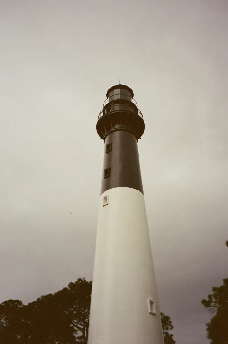 A portrait film photograph of Hunting Island lighthouse in South Carolina