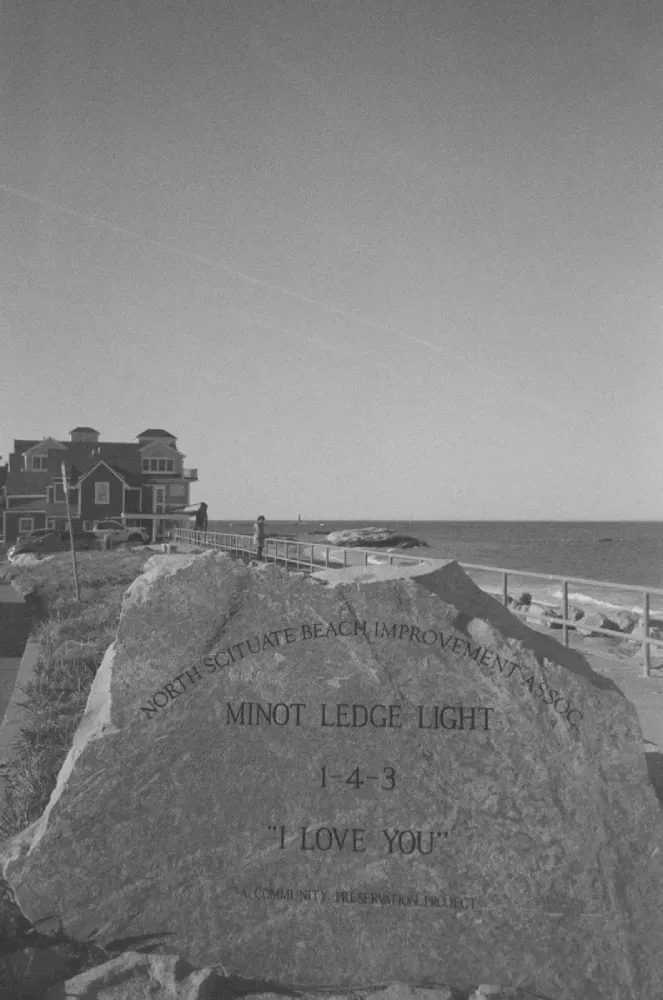 A black and white portrait film photograph of Minor Ledge lighthouse in Massachusetts
