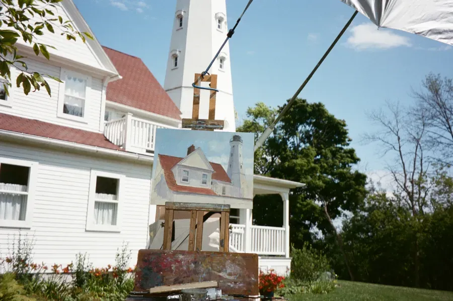 North Point Lighthouse with a painting on an easel