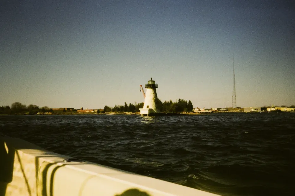 A film photograph of the Palmer Island lighthouse in Massachusetts