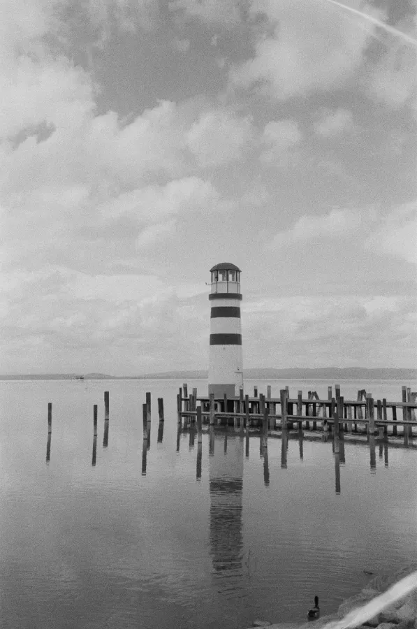 A black and white film photograph of Podersdorf Lighthouse in Austria