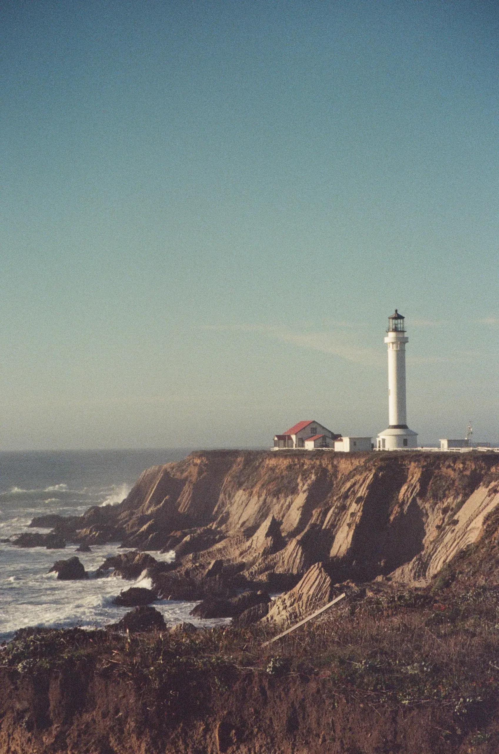 A film photograph of the Point Area lighthouse in California